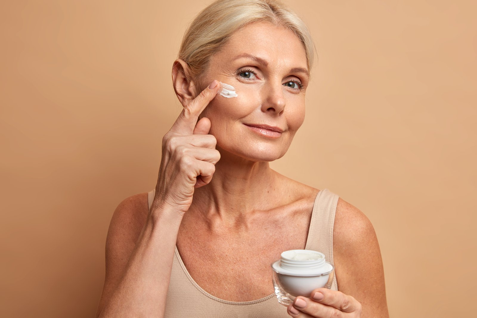 Eye cream being applied around the delicate under-eye area